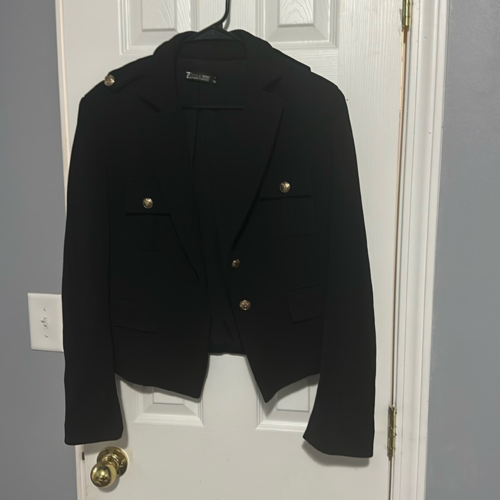 A black blazer with gold buttons
